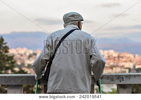 Elder Man Enjoying Life, Looking Town From The High From Viewpoint