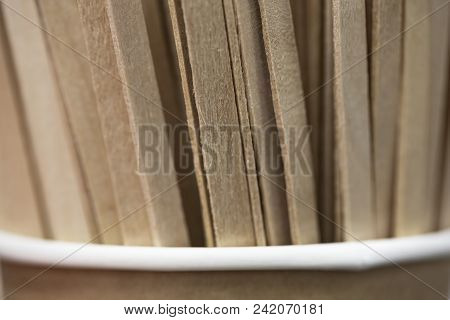 Wooden Stir Sticks In Paper Glass. Sticks For Coffee