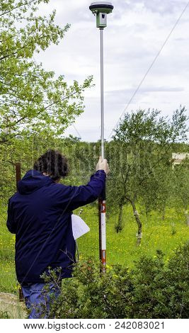 Professional Land Surveyor Measures Ground Control Point Using A Gnss Rover