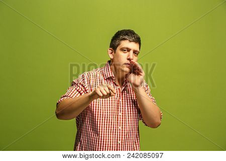 Secret, Gossip Concept. Young Man Whispering A Secret Behind His Hand. Businessman Isolated On Trend