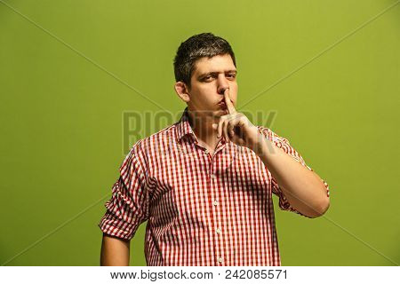 Secret, Gossip Concept. Young Man Whispering A Secret Behind His Hand. Businessman Isolated On Trend