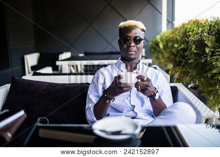 Young Handsome Business African American Man Drinking Coffee In Cafe