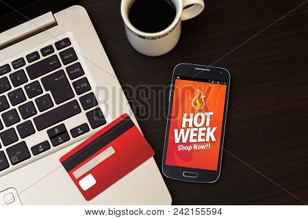 Hot Week Advertising. Special Offer On Smartphone Screen. A Laptop And Credit Card On The Desk. Mark