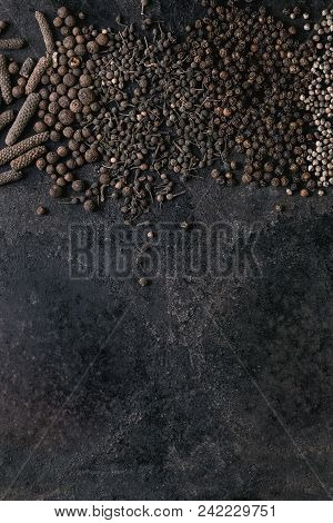 Variety Of Different Black Peppers Allspice, Pimento, Long Pepper, Monks Pepper, Peppercorns Over Ol