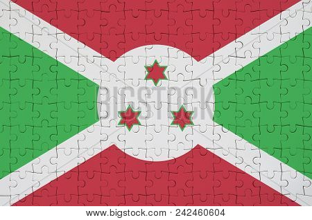 Burundi Flag  Is Depicted On A Folded Puzzle