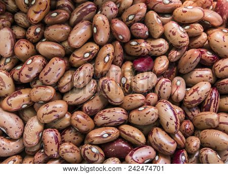 Close Up Orange Red Beans Background And As A Texture. Healthy Vegetarian Dietary Food Rich In Micro