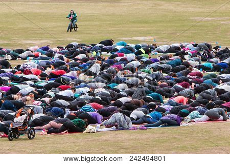 Atlanta, Ga - April 2018:  Dozens Of People Do A Yoga Pose In Unison As They Take Part In A Massive 
