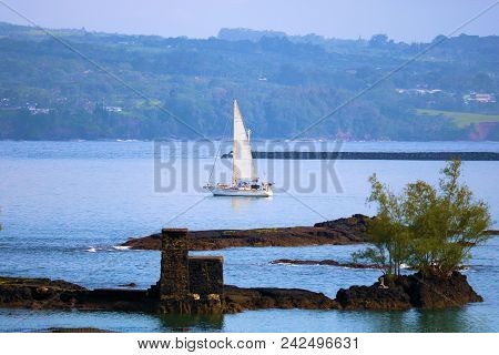 May 16, 2018 In Hilo, Hi:  Sail Boat Sailing In The Calm Waters Of The Hilo, Hi Bay Where People Can