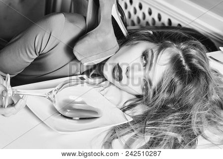 Woman Face Beauty. Sensual Elegant Glamour Young Drunk Woman With Beautiful Hair Lying On Table With