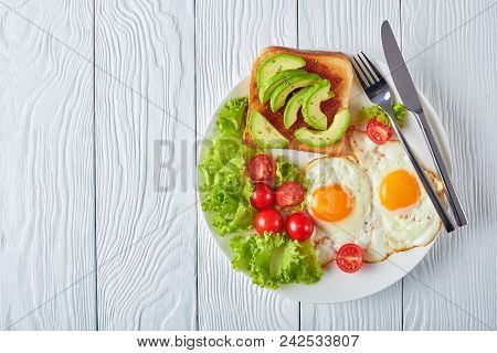 Fried Eggs, Fresh Salad, Toast On A Plate