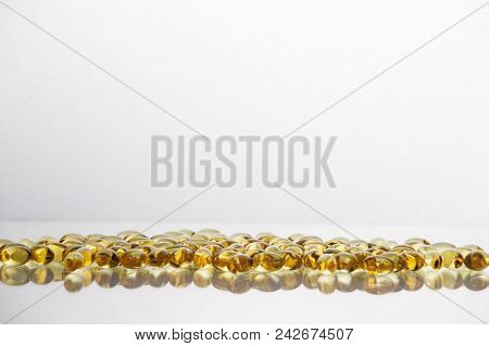 Fish Oil Supplement Capsules Isolated On White Background