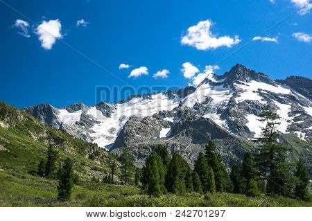 Mountain Landscape. The Top Of The Mountain On The Background Of Blue Sky