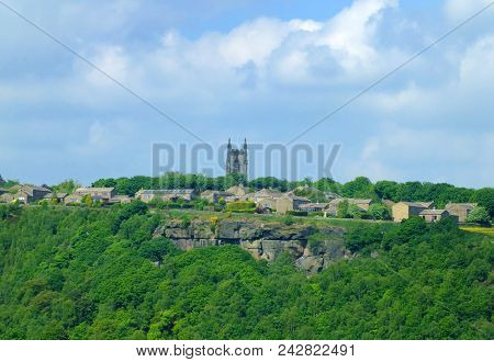 The Pennine Village Of Heptonstall Viewed From Across The Calder Valley With Historic Church Houses 