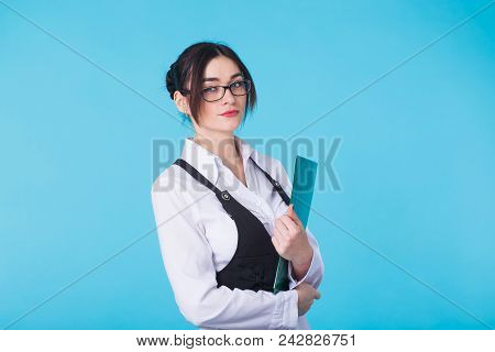 Business Woman With Folder On Blue Background.