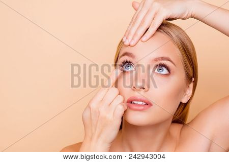 Portrait Of Pretty, Charming, Nude, Natural Cute Girl Looking Up Applying Crystalline Lens In Right 