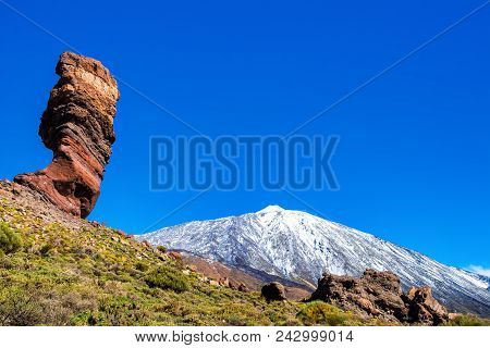 Amazing View Of Unique Roque Cinchado Rock Formation With Famous Pico Del Teide In The Background On