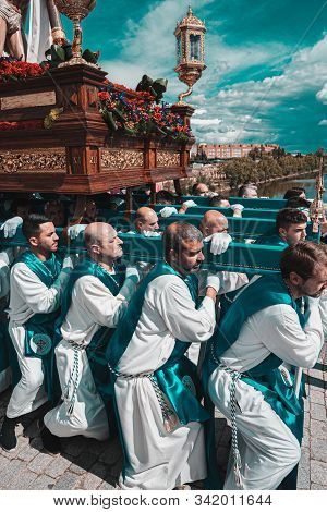 Merida, Spain. April 2019: A Group Of Bearers, Called Costaleros, Carrying A Religious Float