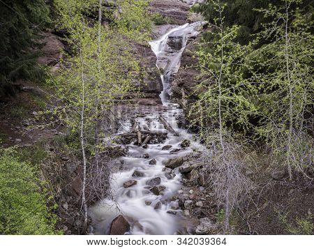 Cascading Waterfall In The Colorado Rocky Mountains.