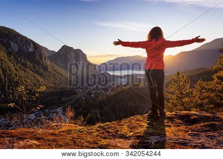 Adventurous Girl Hiking In The Mountains During A Sunny Autumn Sunset. Taken Squamish, North Of Vanc