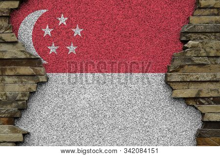 Singapore Flag Depicted In Paint Colors On Old Stone Wall Closeup. Textured Banner On Rock Wall Back