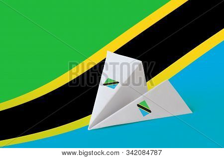Tanzania Flag Depicted On Paper Origami Airplane. Handmade Arts Concept