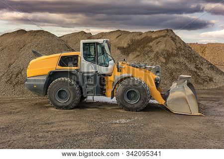 Excavator Moving Stone In An Open Pit Mine In Spain