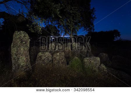 Landscape At Dusk With Ancient Prehistoric Dolmen. Gran Dolmen In Montehermoso. Extremadura Spain.