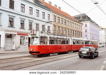 Typical Red Tram On Road In Mariahilfer Strasse In Vienna