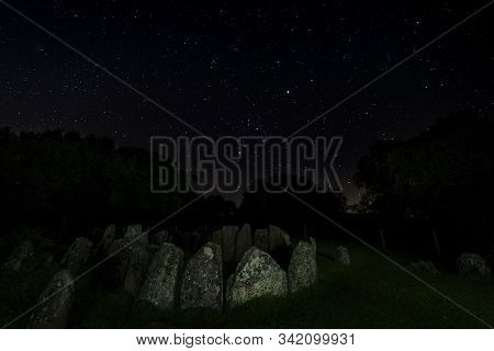 Dolmen Of The Great Oak. Night Landscape With Ancient Prehistoric Dolmen. Montehermoso. Extremadura.