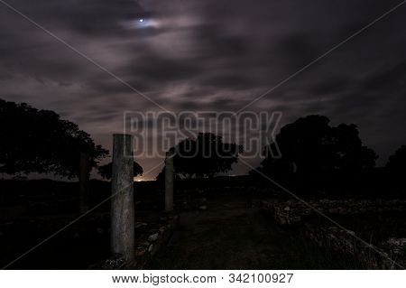 Night Landscape With Roman Ruins. Ancient Roman Villa Of Los Terminos In Monroy. Extremadura. Spain.
