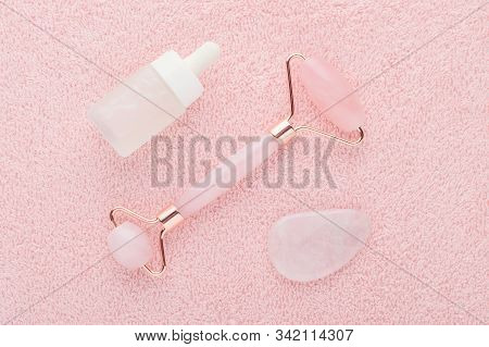 Real Rose Quartz Facial Roller, Gua Sha Massage Stone And Face Serum, Flat Lay