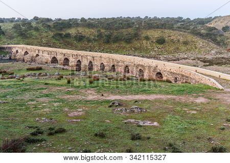 Ancient Roman Bridge Over The Salor River, Located Near Aliseda. Extremadura. Spain.
