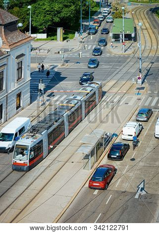Typical Red Tram And Car Transport On Museumstrasse In Vienna