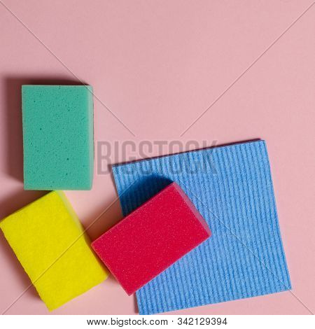 Multi-colored Inoperes For Cleaning The House On A Colored Background With A Place For Text