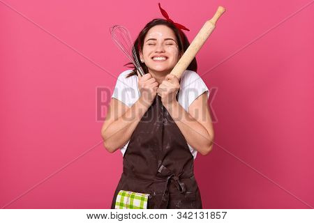 Happy Housewife Or Baker Chef Wearing Kitchen Apron Holding Baking Rolling Pin, Posing Isolated Over