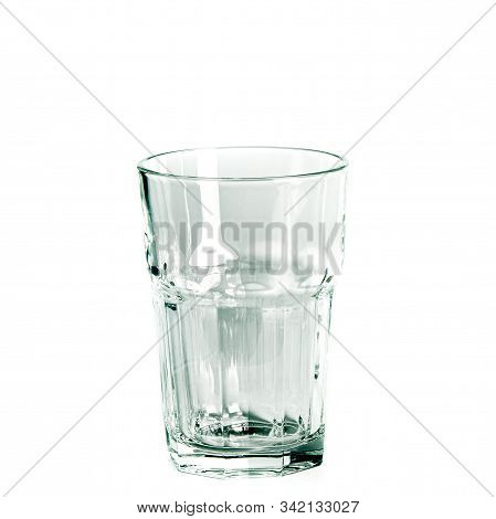 An Empty Glass And A Carafe For Water Stand On A White Background