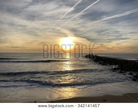 Bright Sunset On The Beach Of Costa Da Caparica, Portugal