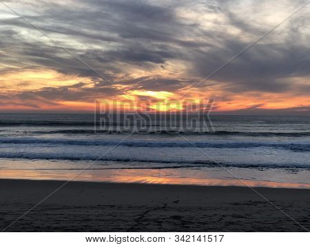 Bright Sunset On The Beach Of Costa Da Caparica, Portugal