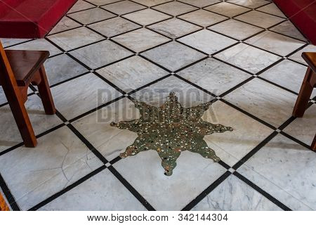 Jerusalem, Israel, December 28, 2018 : Mosaic Star Made On The Floor In The St. Nicholas Church Dung