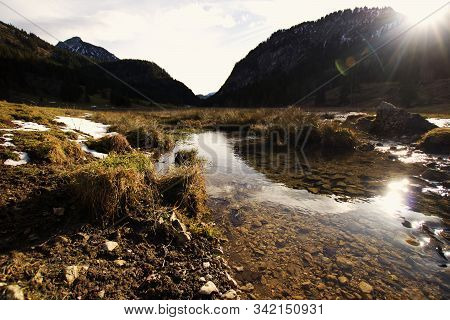 Small Creek In A Valley Of The Alps