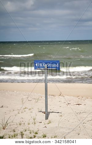 Sign Indicating Where To Go To The Fkk Nudist Section On The Baltic Sea
