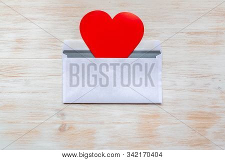 Open White Envelope With Red Paper Heart For Valentine Day On Vintage White Painted Wooden Backgroun
