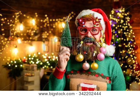 Christmas Tree. Merry Christmas And Happy New Year. Bearded Santa Claus In Party Glasses Holds Small