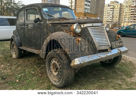 Kiev, Ukraine, December 2019: - Antique Retro Rusty Gray Car Nsu-fiat Limousine, Is Parked In Urban 