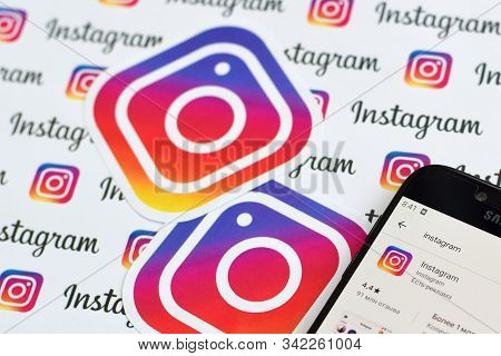 Instagram App On Samsung Smartphone Screen On Banner With Small Instagram Logos. Instagram Is Americ
