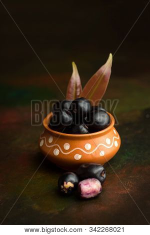 Jambolan Plum Or Jambul Or Jamun Fruit, Java Plum (syzygium Cumini) On Textured Background.