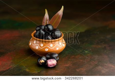 Jambolan Plum Or Jambul Or Jamun Fruit, Java Plum (syzygium Cumini) On Textured Background.