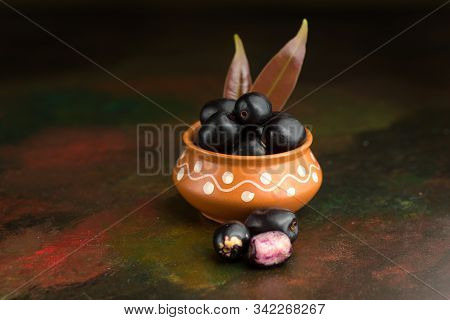 Jambolan Plum Or Jambul Or Jamun Fruit, Java Plum (syzygium Cumini) On Textured Background.