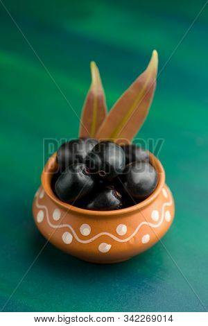 Jambolan Plum Or Jambul Or Jamun Fruit, Java Plum (syzygium Cumini) On Textured Background.