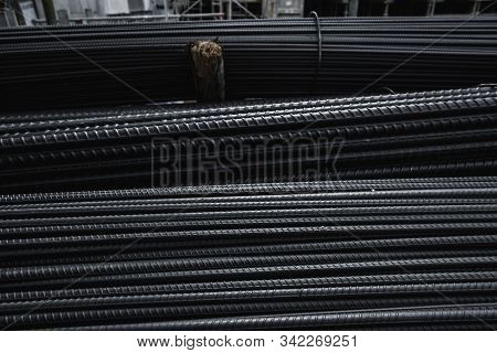 Building Armature In The Warehouse Of Metallurgical Products Or On Construction Site. Stack Of Heavy